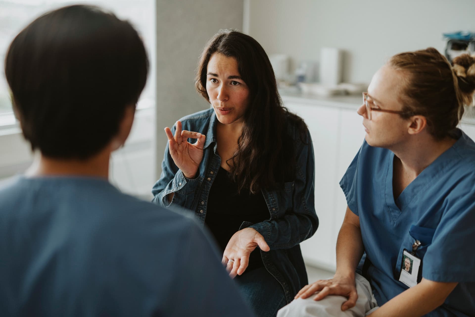 Researcher in conversation with fertility clinicians