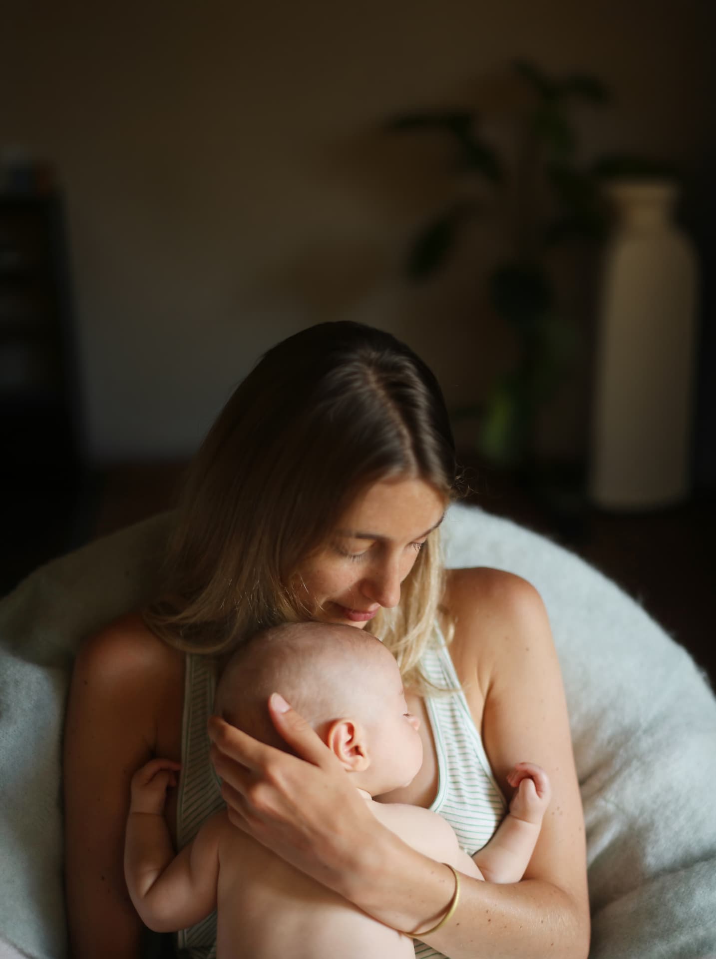 Mother holding her baby close